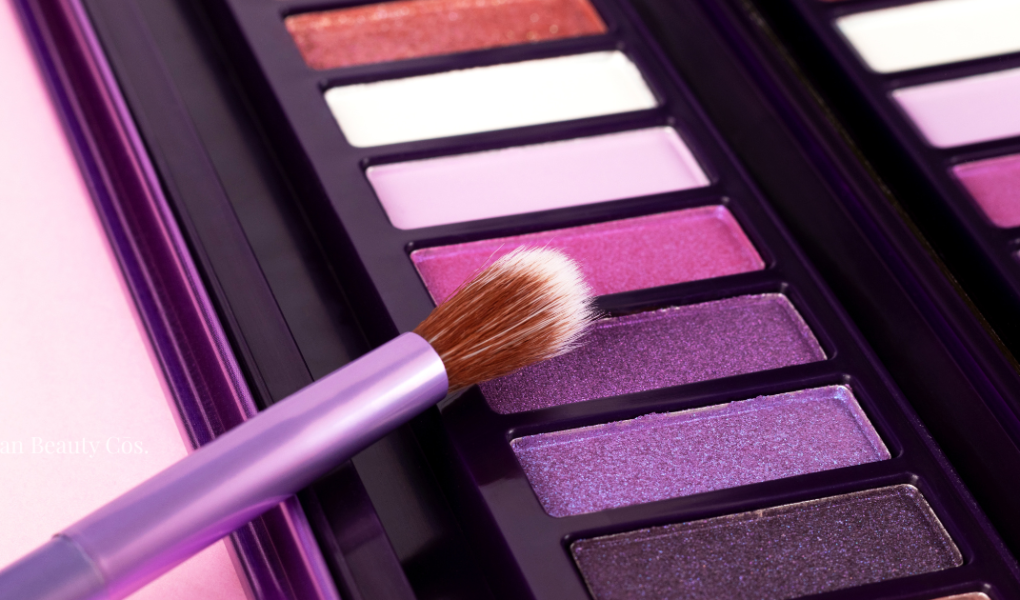 A palette of vibrant pink and purple eyeshadows, which often contain carmine in eye makeup that can trigger allergic reactions.