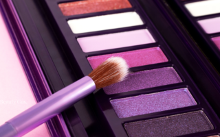 A palette of vibrant pink and purple eyeshadows, which often contain carmine in eye makeup that can trigger allergic reactions.
