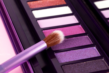 A palette of vibrant pink and purple eyeshadows, which often contain carmine in eye makeup that can trigger allergic reactions.