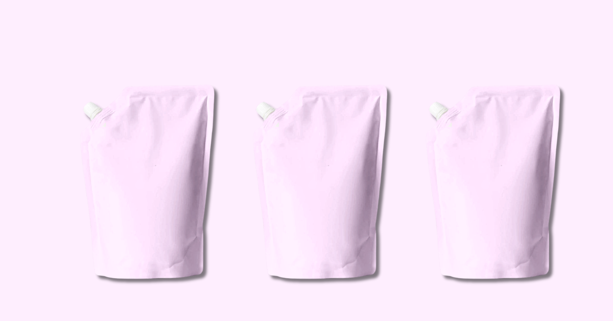 Three identical pink shampoo refill pouches arranged on solid pink background showcasing sustainable hair care packaging
